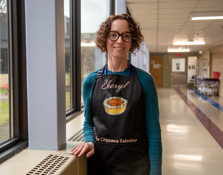 Chryl Kidd, biomedical technologist, in her Chippawa Bakeshop apron