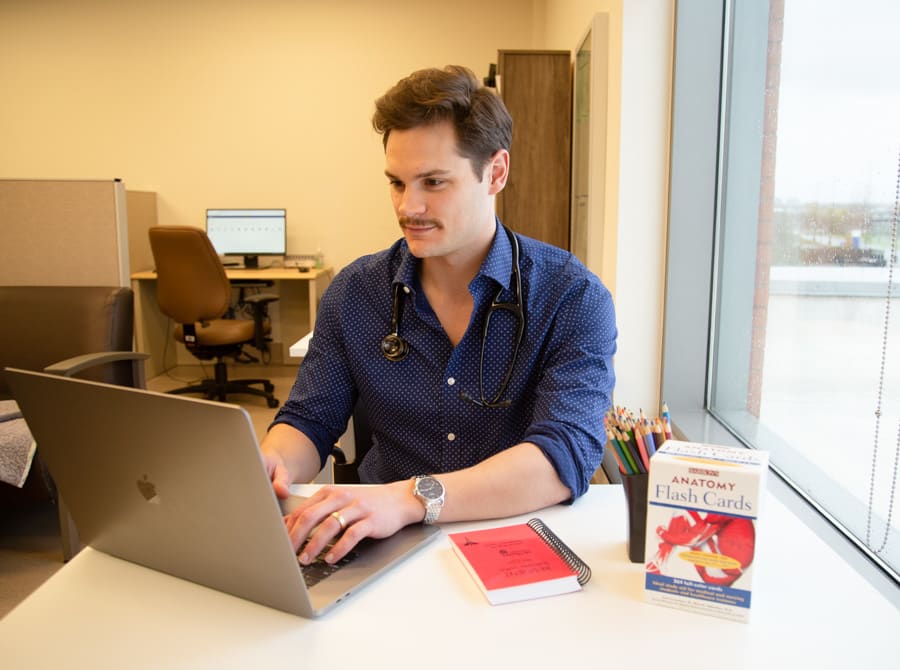 Grant Sweeny works on his laptop in the student lounge at the St. Catharines Hospital