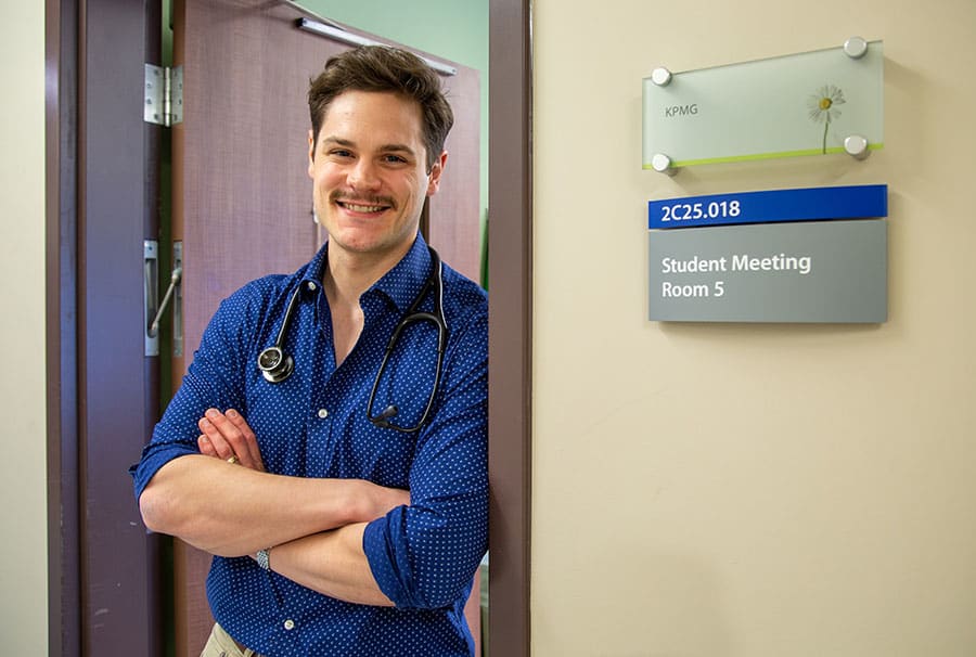 Medical Learner Grant Sweeny in the doorway to the medical student lounge at the St. Catharines Hospital