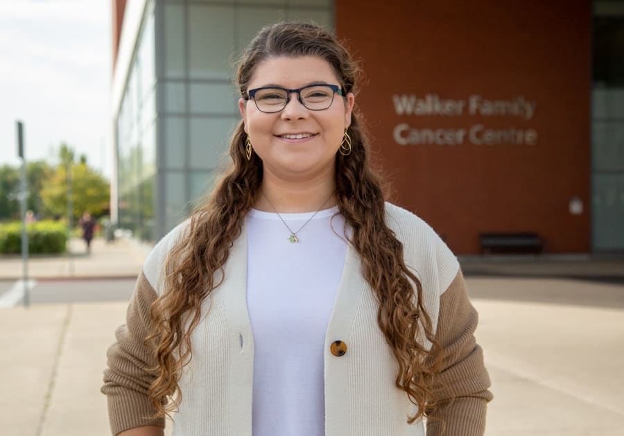 McMaster medical student Keira Parr stands outside the Walker Family Cancer Centre